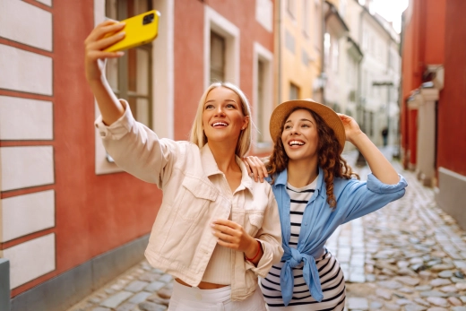 Happy travellers using their phones